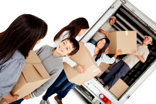 Furniture removals team preparing items in a Balham home