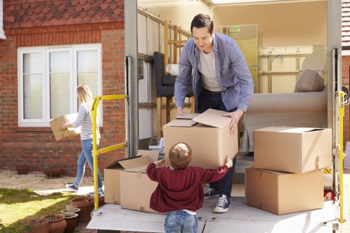 Professional flat removals in Balham with careful loading outside an apartment building