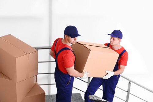 Removal team preparing household items for transport