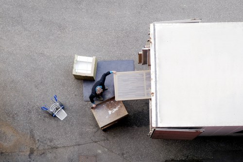 Movers protecting furniture during a Balham apartment relocation