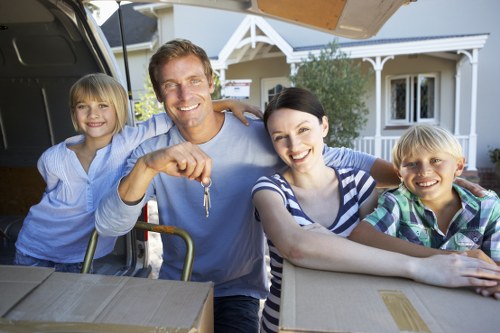 Professional movers loading furniture into a moving truck in Balham