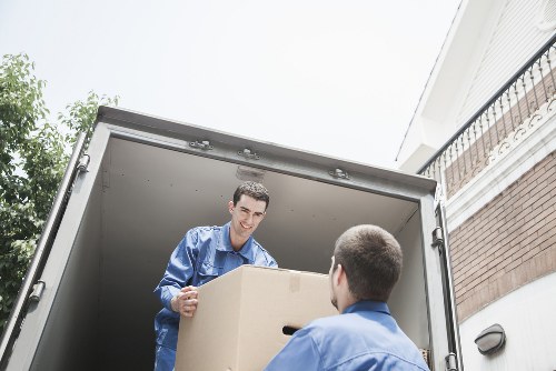 Professional moving support with boxes and furniture in Balham