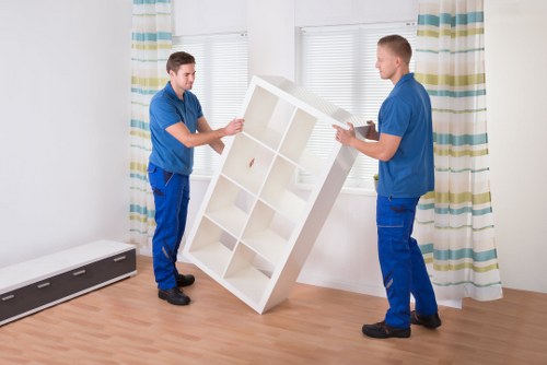 Professional movers loading furniture for a same day move