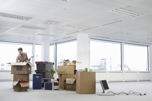 Professional movers carrying furniture carefully with safety measures in place